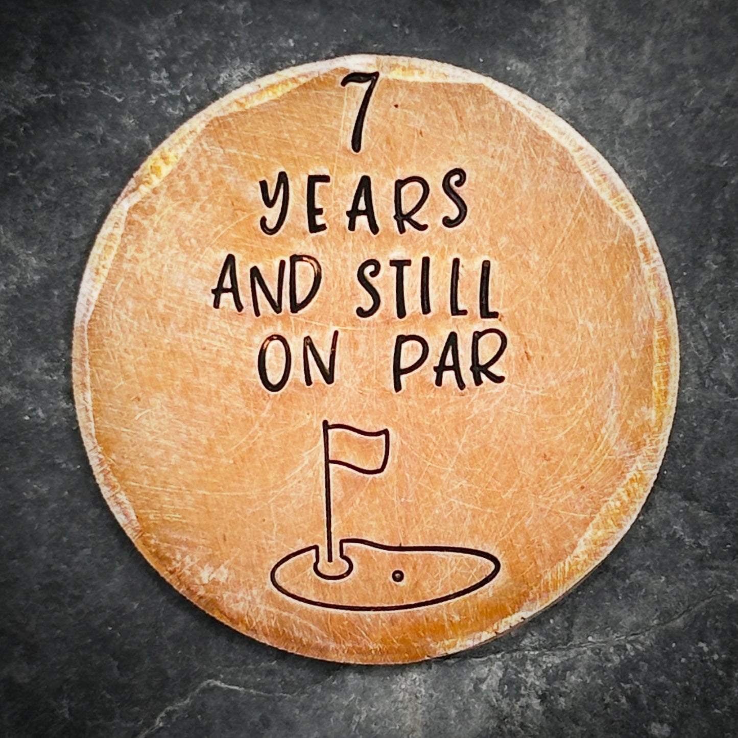 7 years and still on par. Golf ball marker