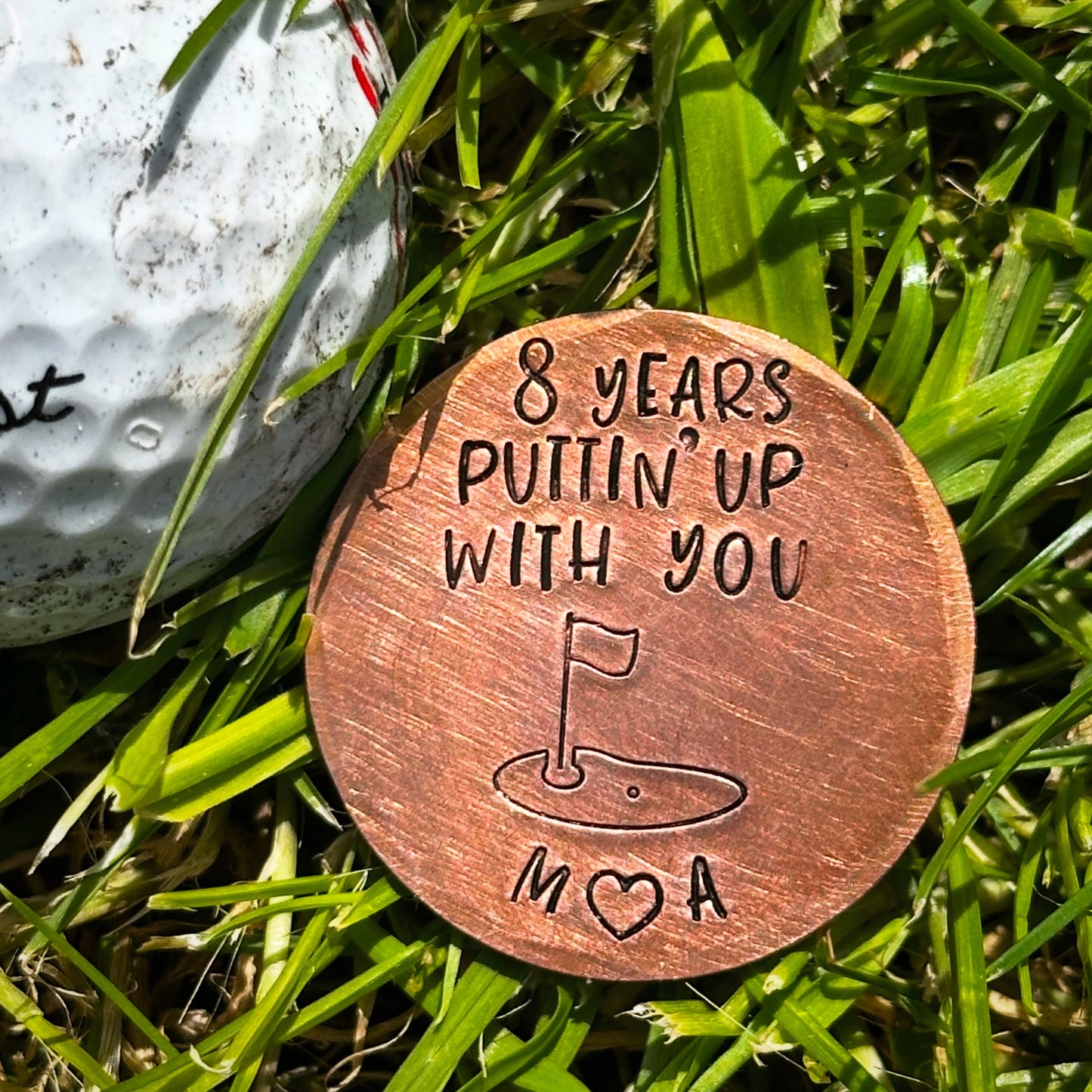 8 years and still puttin up with you. Golf ball marker