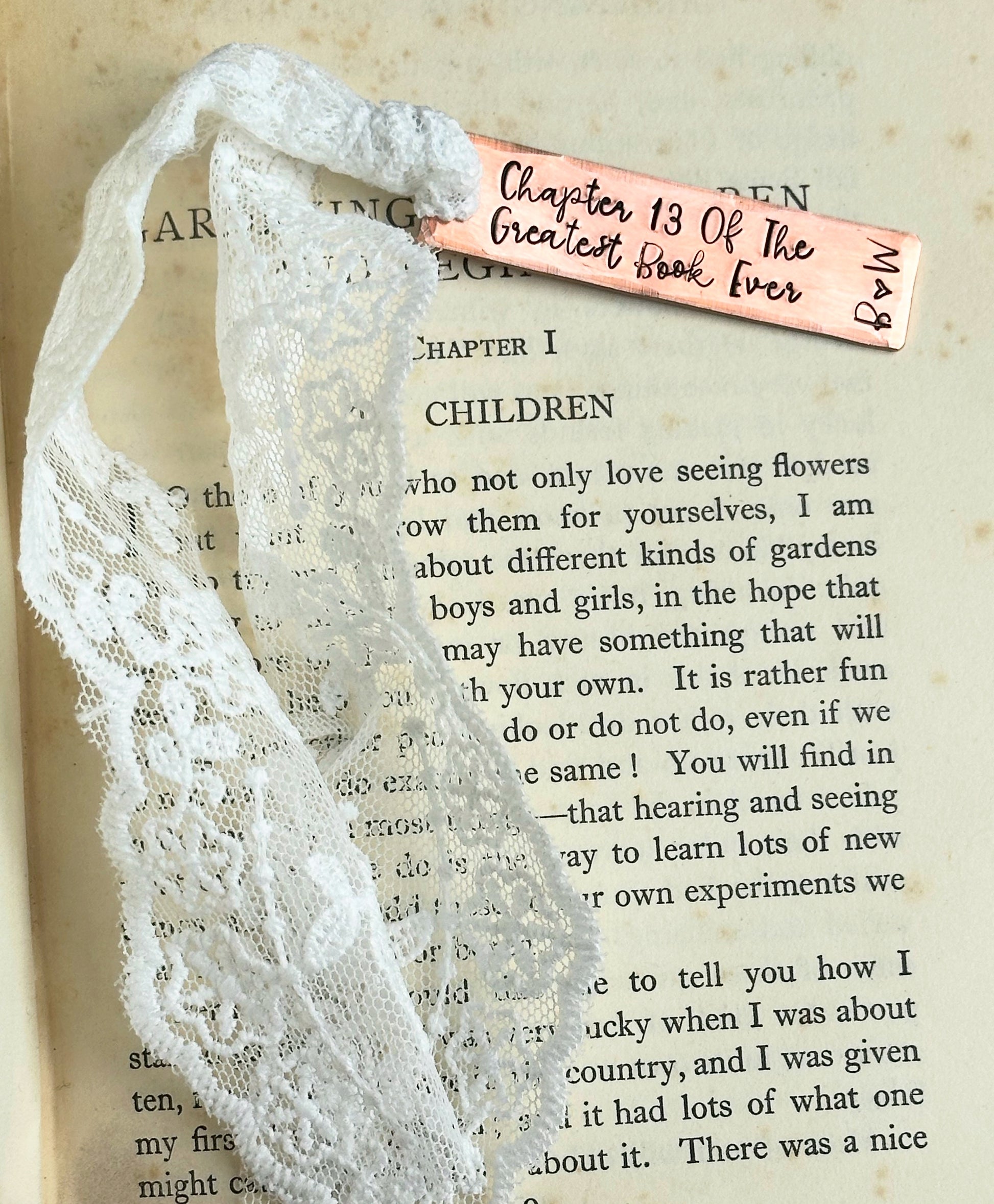 personalised traditional 13 year anniversary Lace bookmark with a copper tag reading 'Chapter 13 of the Greatest Book Ever
