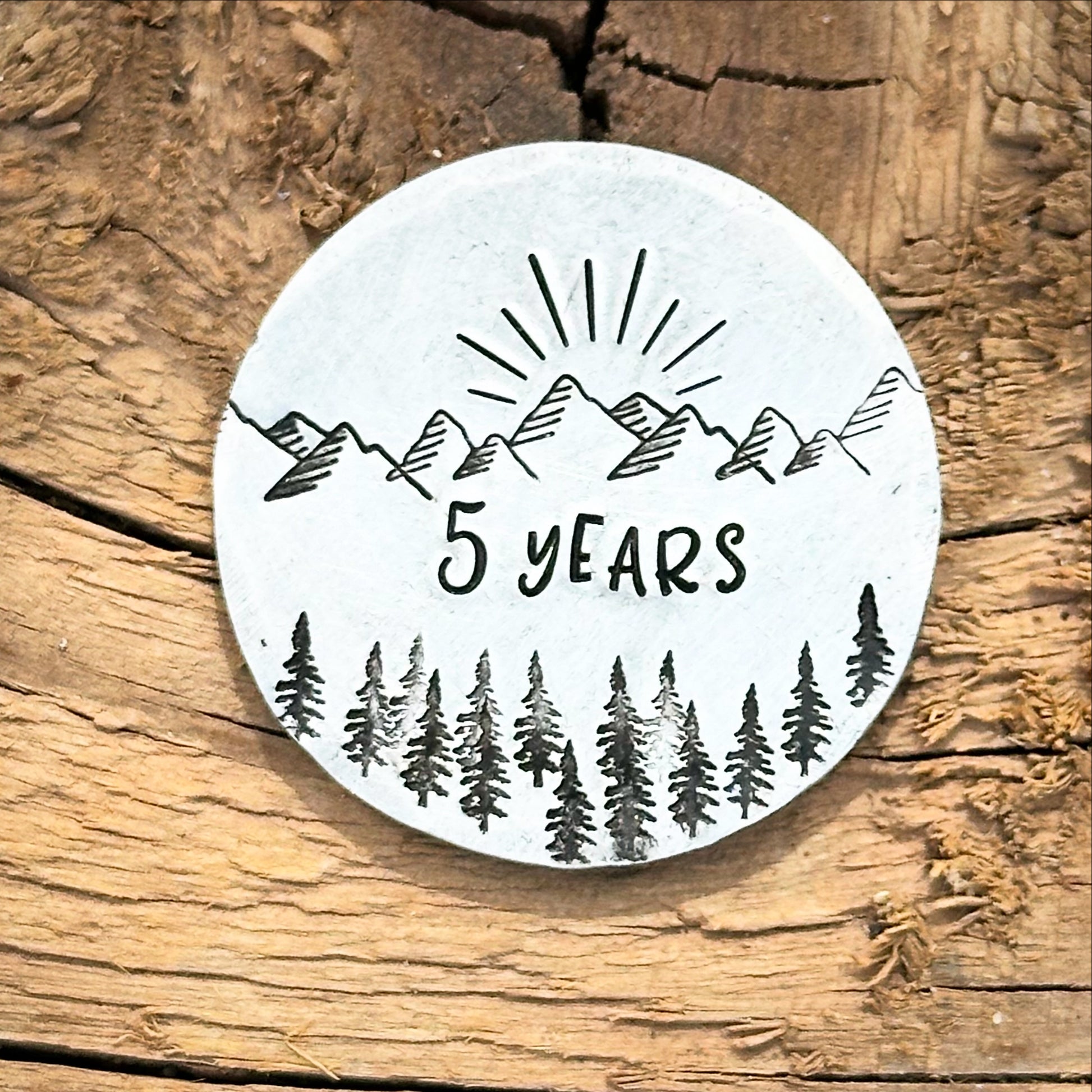 A silver personalized sobriety gift coin